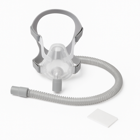CPAP supplies including a full-face CPAP mask with gray headgear, a single continuous corrugated CPAP hose, and a white filter pad on a clean white background.