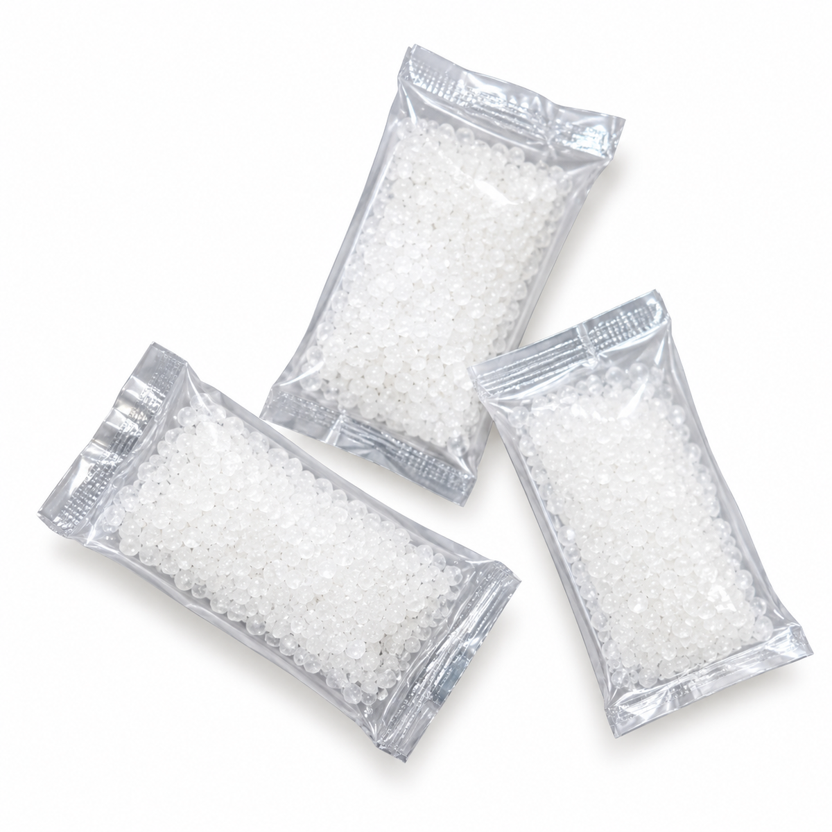 Three individual Cymed ILE-SORB absorbent gel packets shown outside the box, featuring clear sealed sachets containing absorbent granules for ileostomy pouch use.