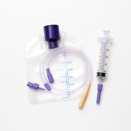 Enteral feeding supplies including an ENFit feeding bag, coiled ENFit tubing, a purple feeding connector, and a clear enteral syringe on a clean white background.